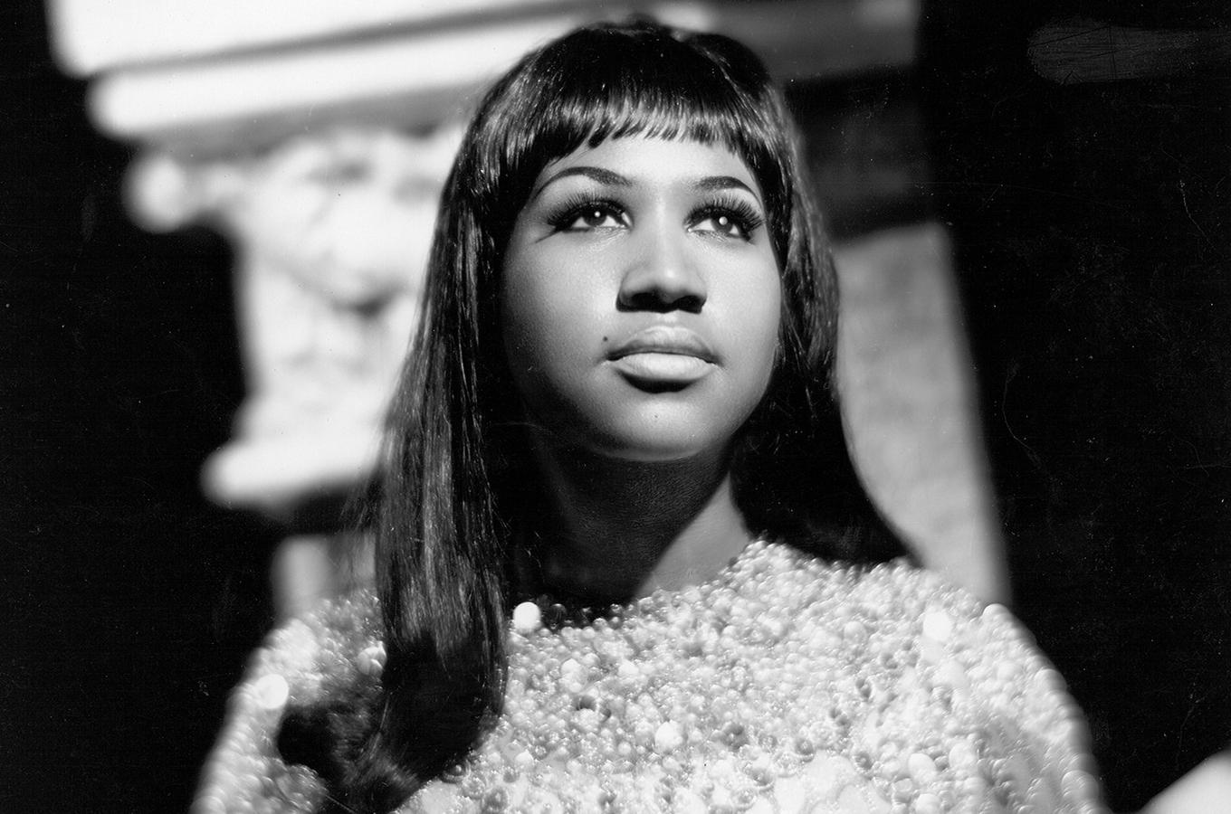 Black and white photo of Aretha Franklin.