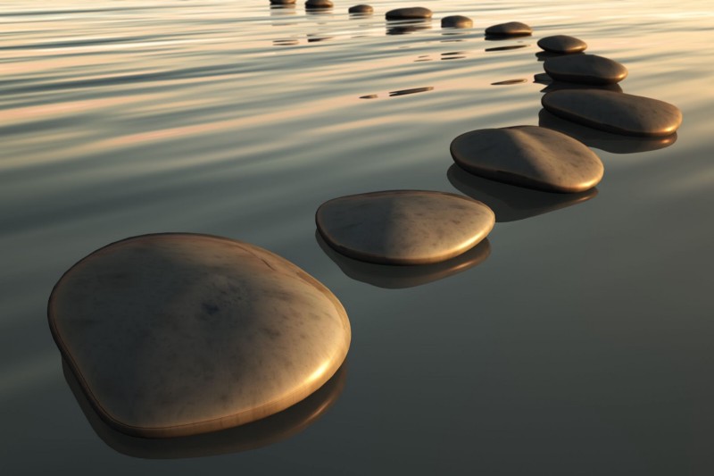 Smooth stone path in the middle of a river.