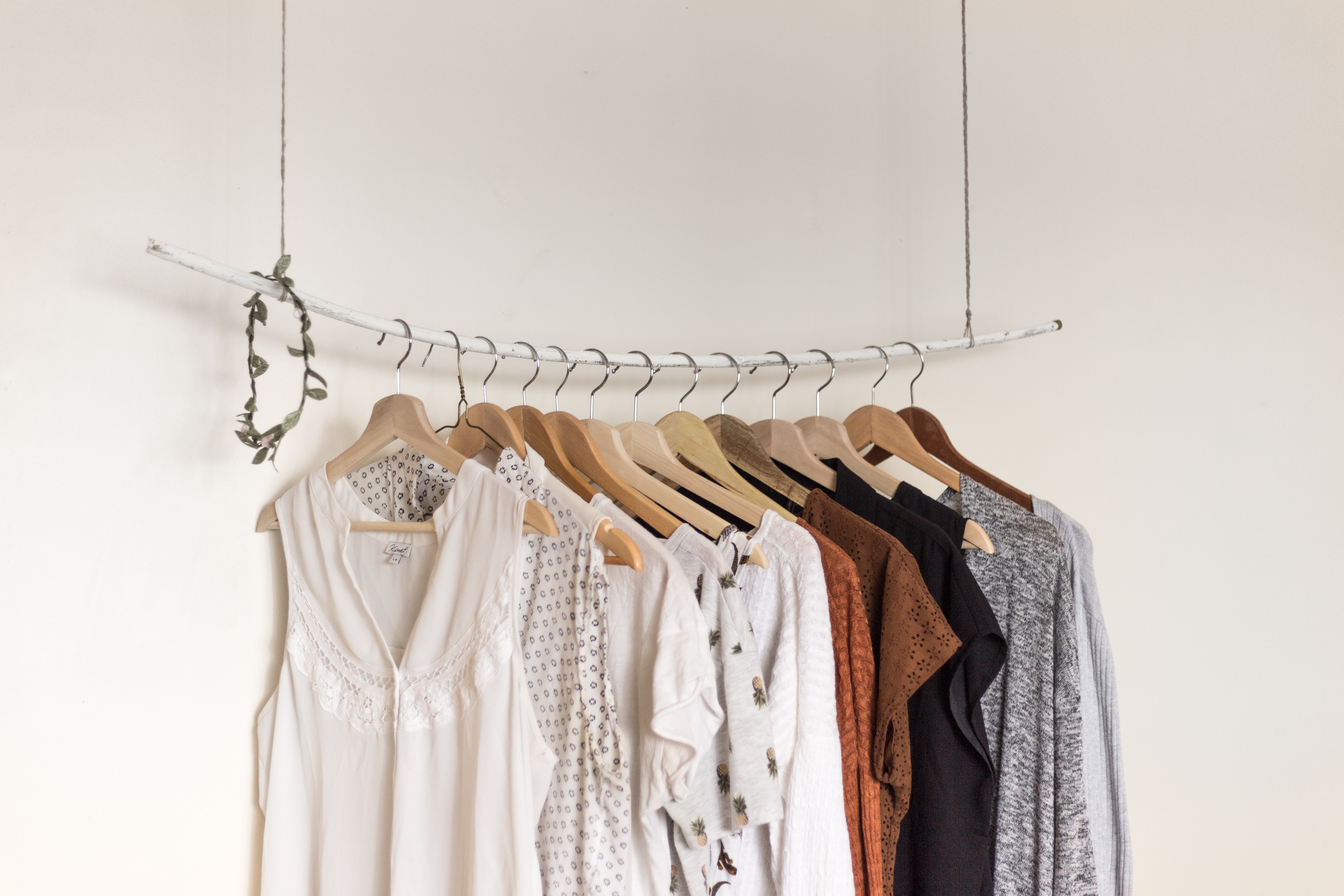 Colorful shirts hanging on a wire.