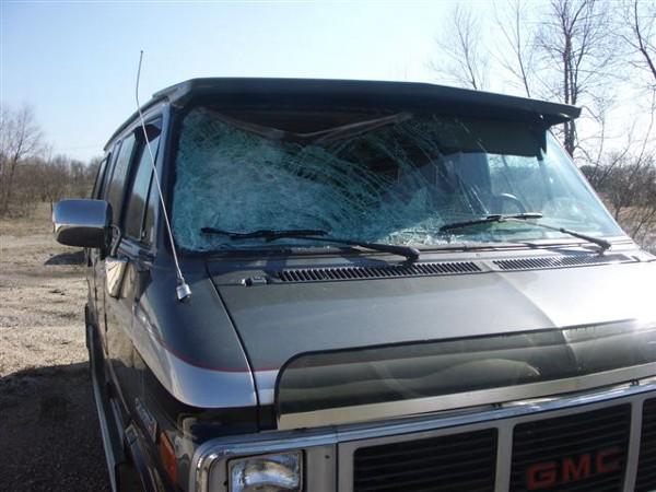Van windshield bent in - outside view.